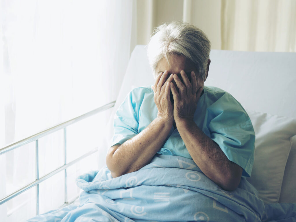 Lonely Elderly patients in hospital bed patients want to go home - medical and healthcare concept